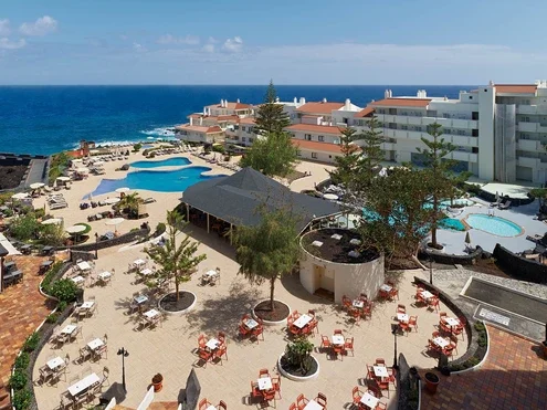 Hotel and swimming pool general view facing the sea